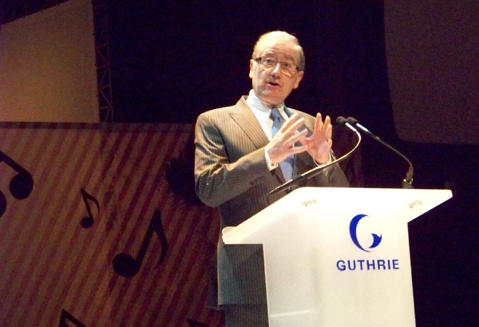 FILE - In this March 23, 2009 file photo, Director of the Guthrie Theater Joe Dowling speaks at a staff meeting at the Guthrie Theater in Minneapolis. Dowling plans a mix of some of his favorite plays, new works and a classic American musical for his final season. After 20 years, Dowling steps down next year. The Guthrie announced the lineup Thursday, April 10, 2014. (AP Photo/Jeff Baenen, file)