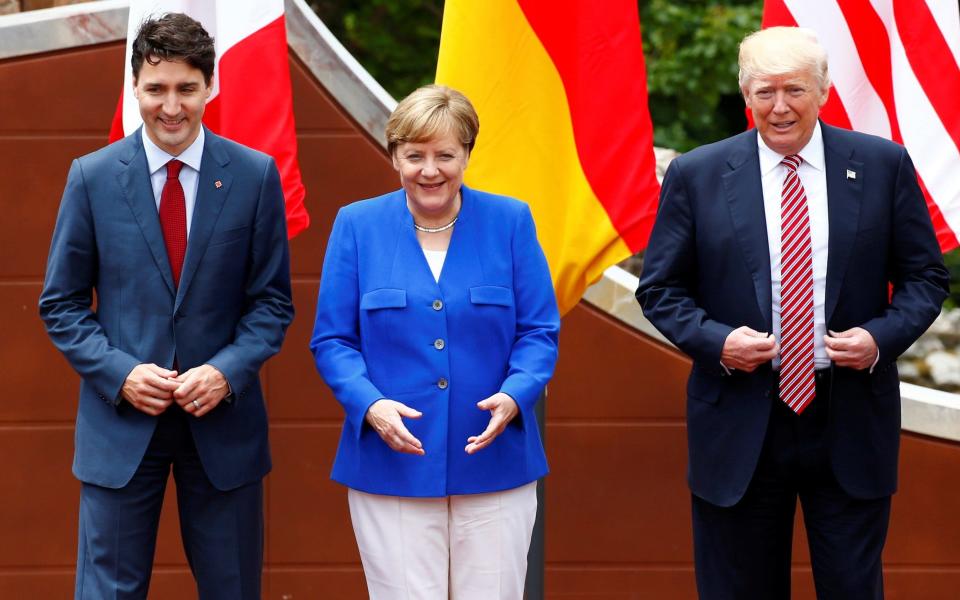 US President Donald Trump, Germany's Chancellor Angela Merkel and Canadian Prime Minister Justin Trudeau attend the G7 summit in Taormina - Credit:  TONY GENTILE/REUTERS