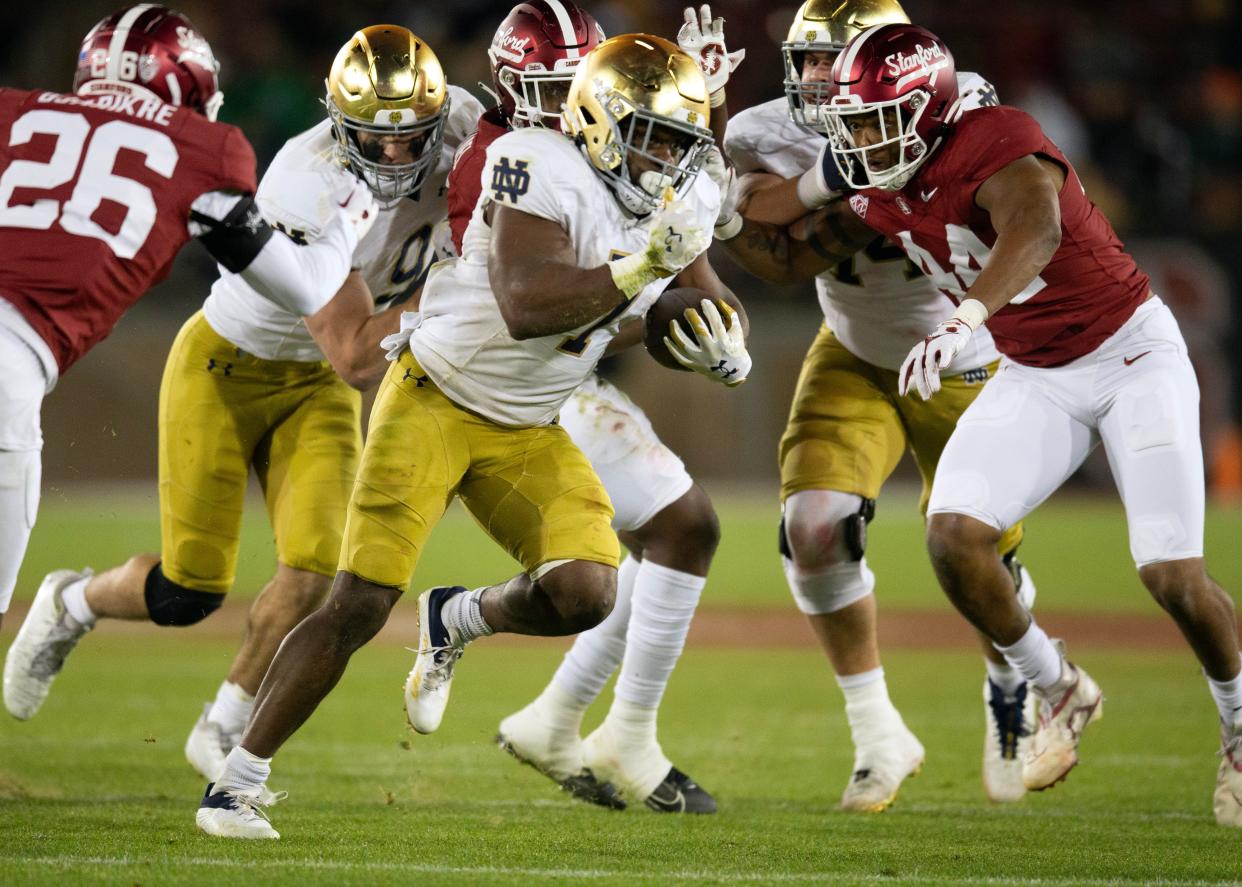 Nov 25, 2023; Stanford, California, USA; Notre Dame Fighting Irish running back Audric Estimé (7) breaks free for another touchdown run against the Stanford Cardinal during the third quarter at Stanford Stadium. Mandatory Credit: D. Ross Cameron-USA TODAY Sports