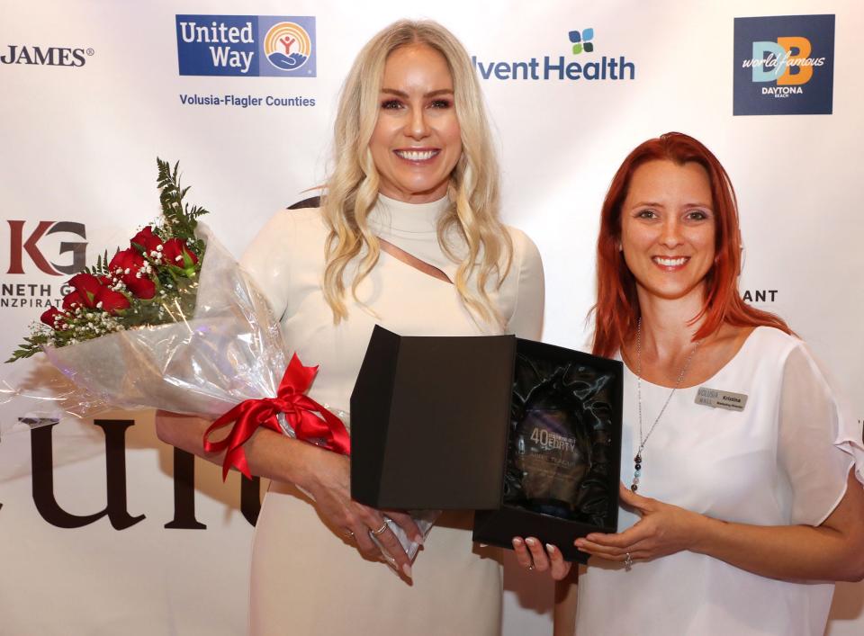 Kristina Circelli, right, presents Abbie Teague of Brown & Brown with the 2023 Young Professional of the Year award at The Daytona Beach News-Journal/LocaliQ's 18th annual Volusia-Flagler "40 Under Forty" event at Kenneth Grant Inzpirations' new Cultuvue exhibit space in Daytona Beach on Tuesday, March 21, 2023. Circelli, marketing director for Volusia Mall, won the award last year.