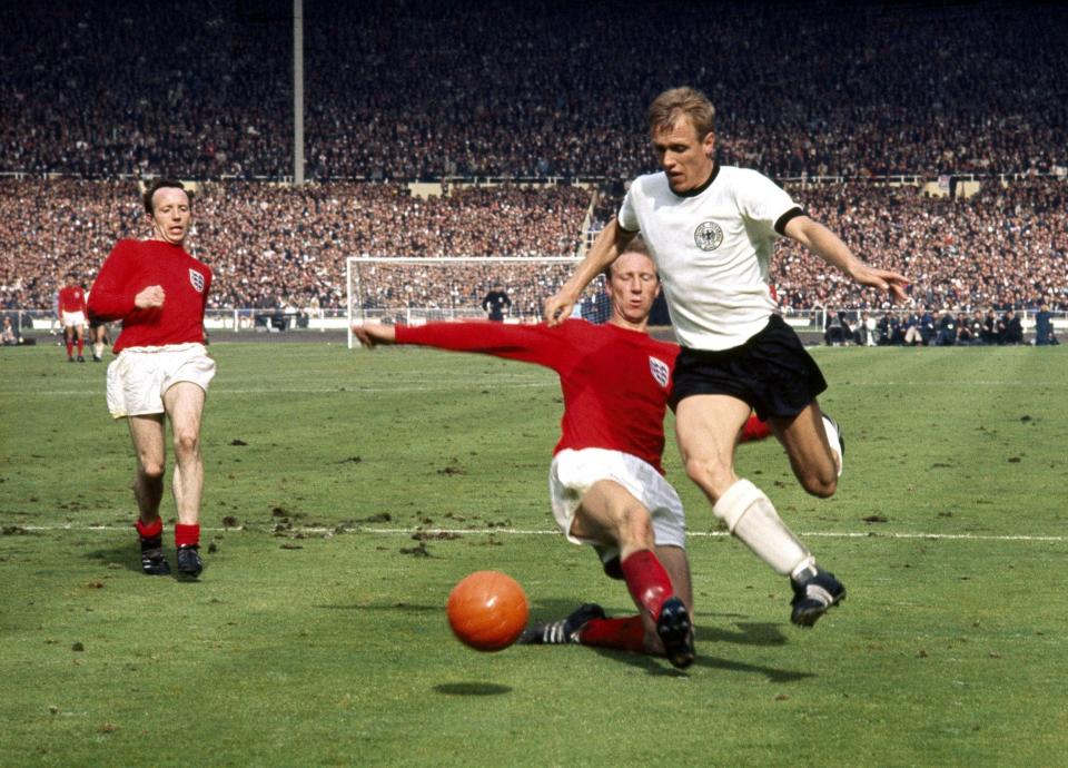 Nobby Stiles looks on as Jack Charlton makes a tackle in the England v West Germany World Cup Final, Wembley, London, July 30 1966 -  Offside / Rex Features