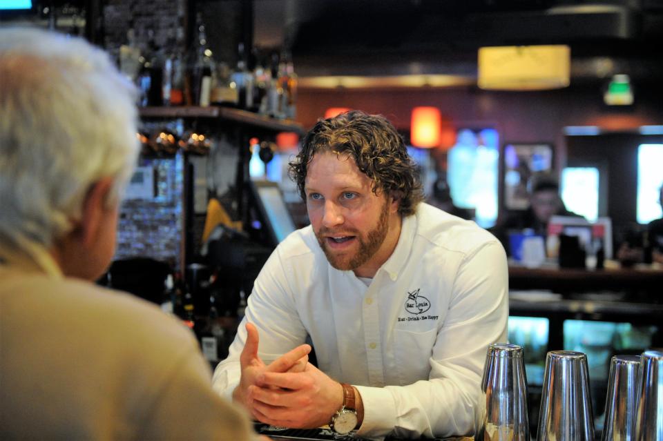 Chase Oswald of Bar Louie says the bar and restaurant is working on plans for happy hour offerings to begin after July 1, but nothing is set in stone yet.