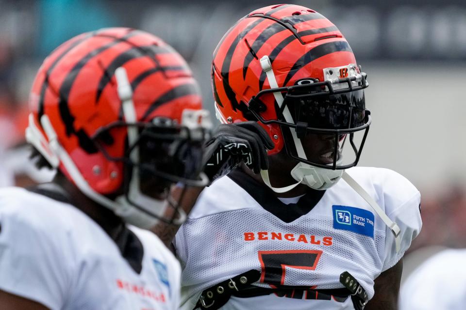 Cincinnati Bengals wide receiver Tee Higgins (5) and wide receiver Ja'Marr Chase (1) line up between reps during a preseason training camp practice at the Paycor Stadium training facility in downtown Cincinnati on Wednesday, Aug. 16, 2023.