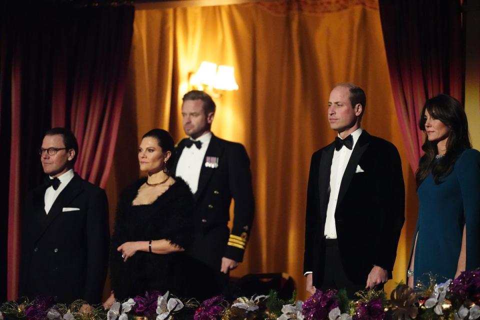 The couple stood for the National Anthem alongside Crown Princess Victoria and Prince Daniel of Sweden (PA)