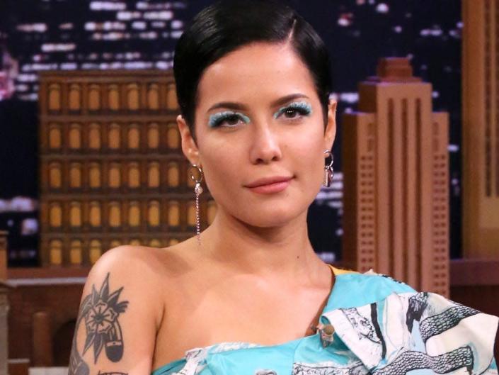 Halsey wearing a blue dress during an appearance on &quot;The Tonight Show Starring Jimmy Fallon&quot; in 2020.