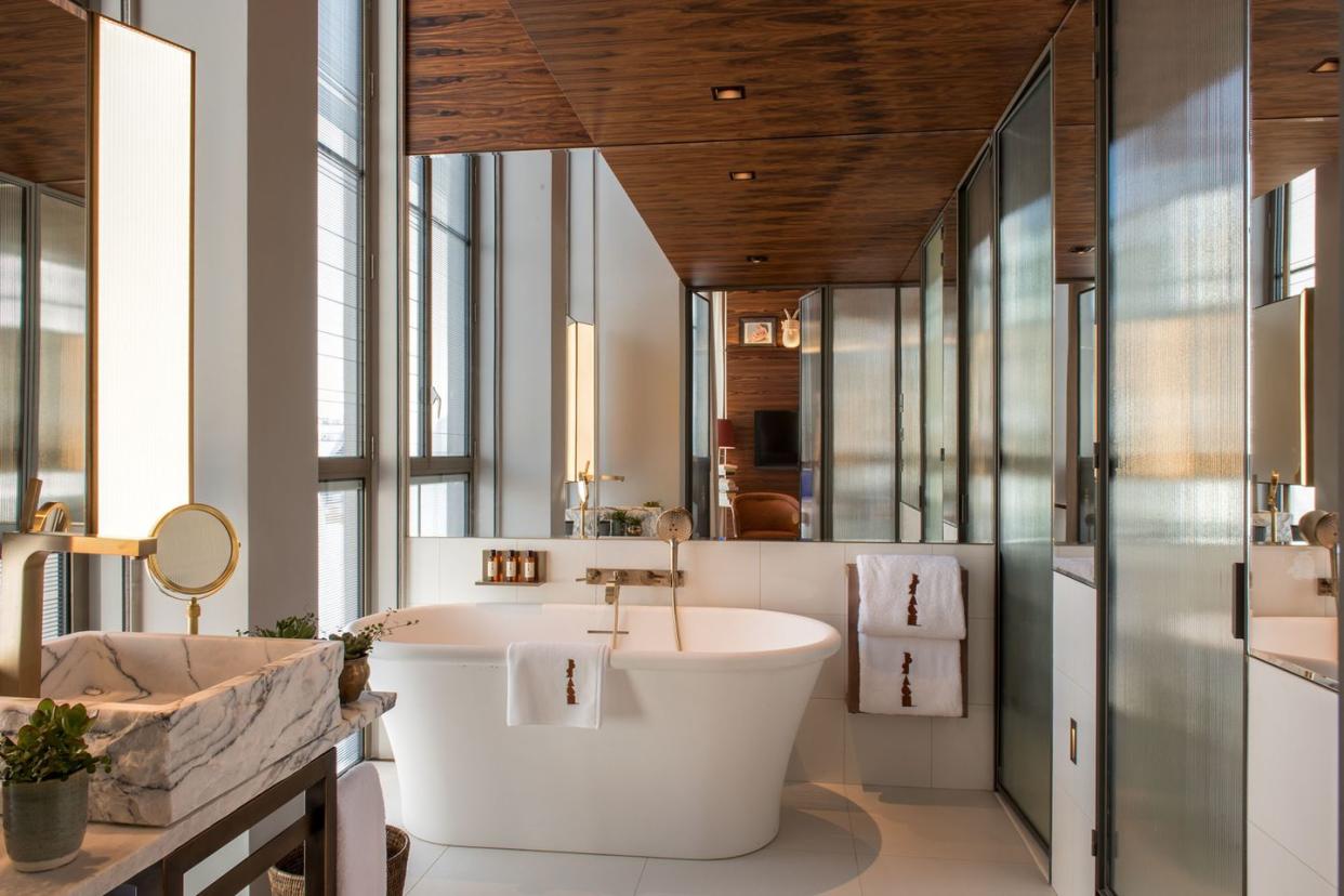 a bathroom with a tub and sink