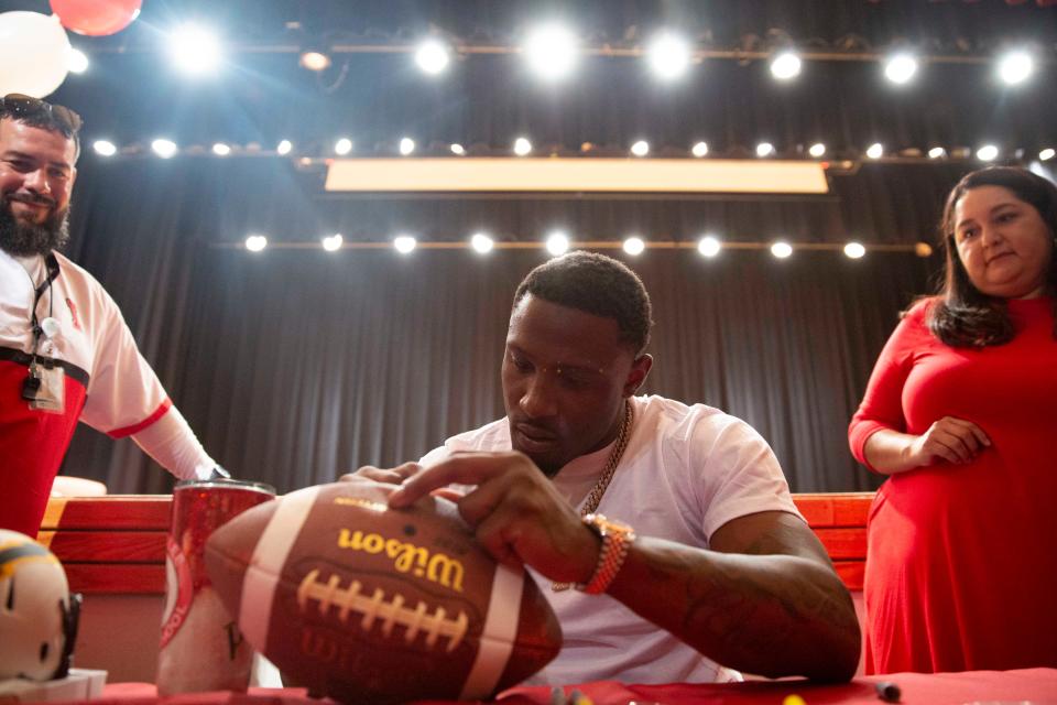 Former Immokalee football stars J.C. Jackson, a Super Bowl champion and Pro Bowl player, pictured, and Edgerrin James, a Pro Football Hall of Fame inductee, hosted an event for students, Monday, May 16, 2022, at Immokalee High School in Immokalee, Florida.Jackson and James signed autographs on helmets, books and gave advice to the students.