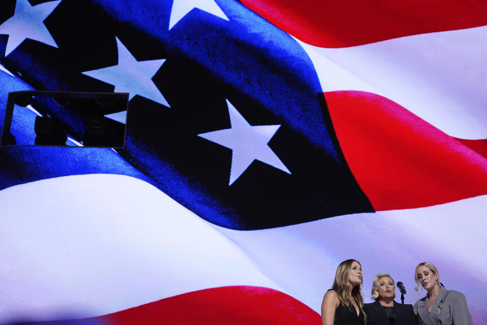 Emily Robison, from left, Natalie Maines and Martie Maguire, of The Chicks, sing the national anthem during the Democratic National Convention Thursday, Aug. 22, 2024, in Chicago. (AP Photo/Brynn Anderson)