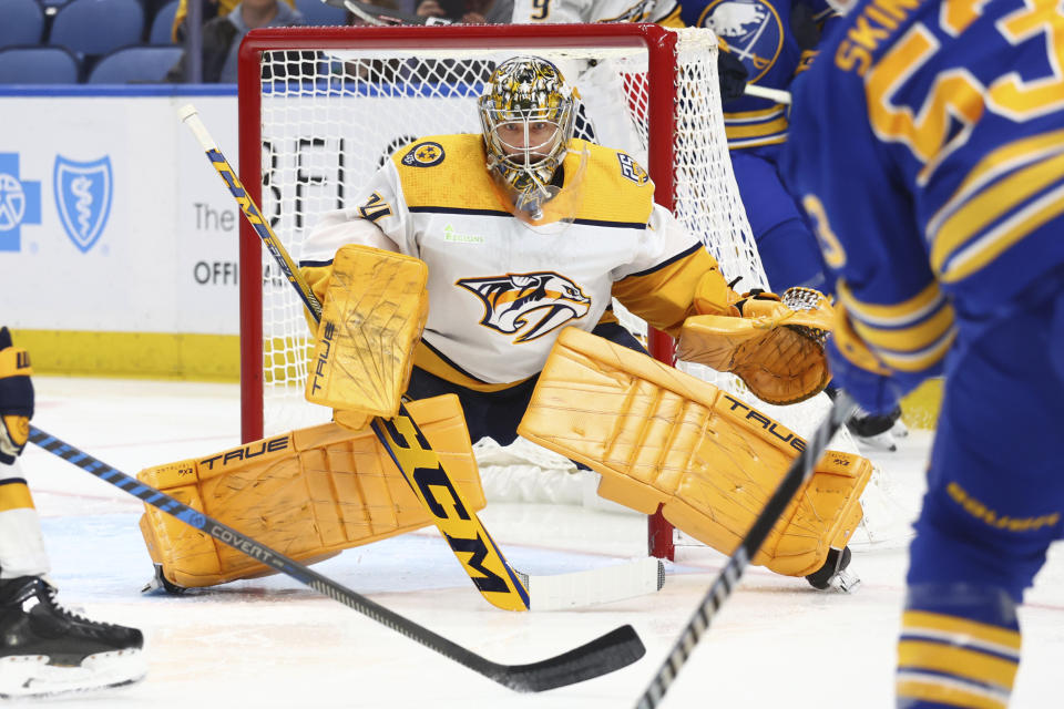 Nashville Predators goaltender Juuse Saros (74) keeps his eyes on the puck during the first period of an NHL hockey game against the Buffalo Sabres, Sunday, Dec. 3, 2023, in Buffalo, N.Y. (AP Photo/Jeffrey T. Barnes)