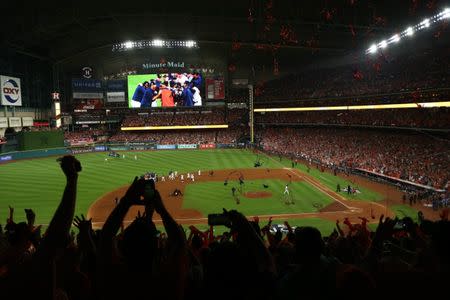 Oct 21, 2017; Houston, TX, USA; Fans celebrate after the Houston Astros win against the New York Yankees in game seven of the 2017 ALCS playoff baseball series at Minute Maid Park. Troy Taormina-USA TODAY Sports