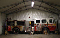 A New York City Fire Department engine recovered from the World Trade Center disaster site sits inside Hangar 17 at New York's John F. Kennedy International Airport June 16, 2011. A program operated by the Port Authority of New York and New Jersey, The World Trade Center steel program, is selecting portions of the steel recovered from the Center and donating it to cities, towns, firehouses and museums around the U.S. and the world who request it for use in 911 memorial sites in time for the 10 year anniversary of the 2001 attacks. Picture taken June 16, 2011. (REUTERS/Mike Segar)