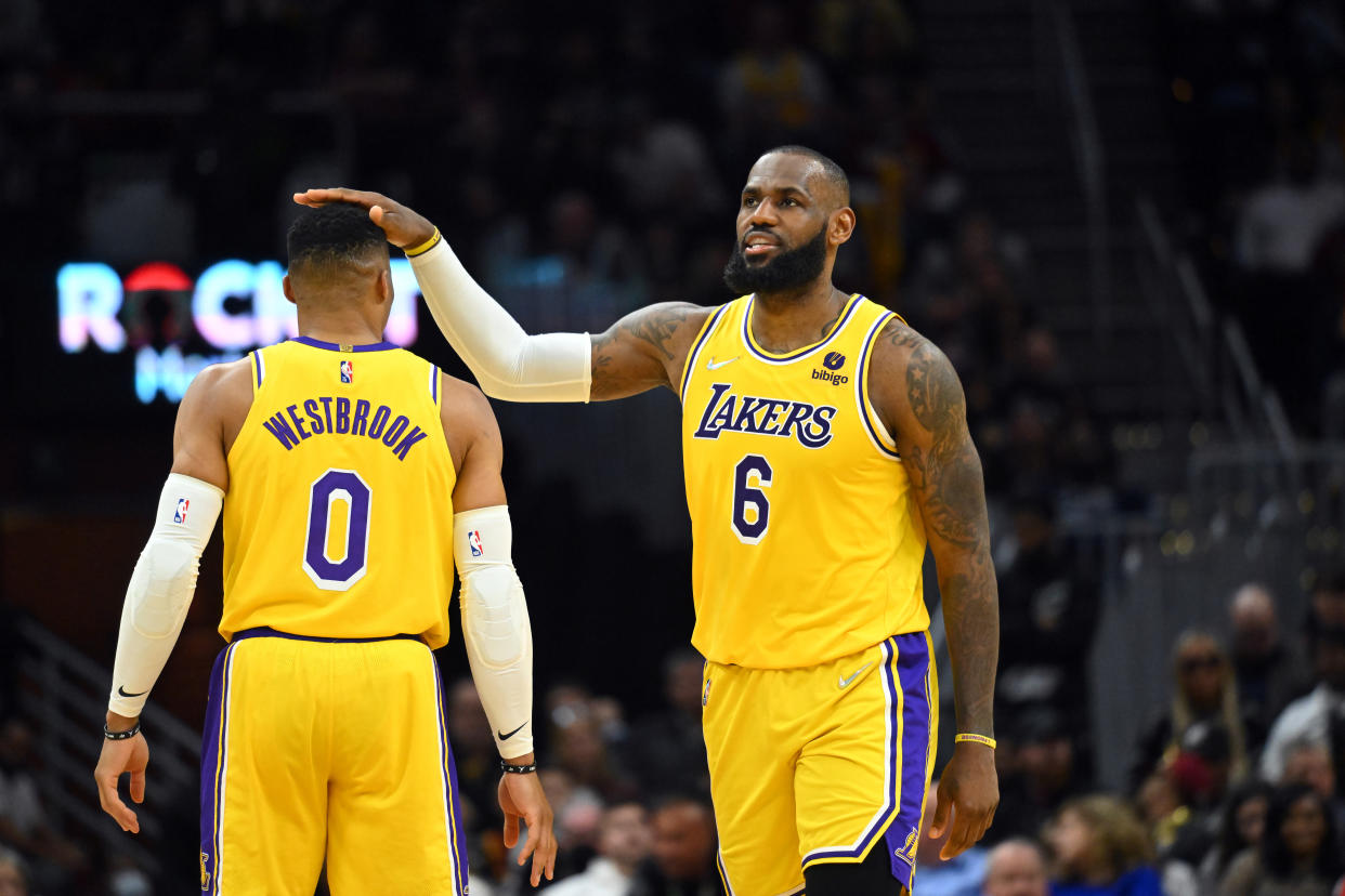 The Los Angeles Lakers' LeBron James pats Russell Westbrook's head during a game last season. (Jason Miller/Getty Images)