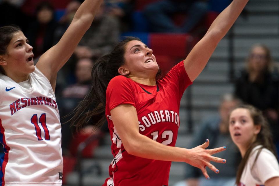 Neshaminy junior Lola Ibarrondo jumps to stop Souderton senior Casey Harter at Neshaminy High School on Friday, Jan. 13, 2023. Neshaminy girls basketball defeated Souderton 37-32.