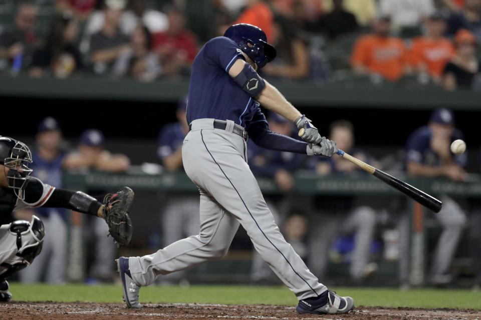 Tampa Bay Rays' Austin Meadows hits a solo home run off Baltimore Orioles starting pitcher Asher Wojciechowski during the third inning of a baseball game Thursday, Aug. 22, 2019, in Baltimore. (AP Photo/Julio Cortez)