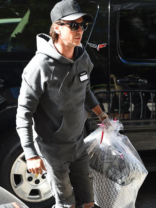 Jonathan Cheban was seen carrying a gift basket for Kim. Source: Getty