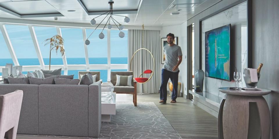 a rendering of people at a dining table and in the living room in the Iconic suite aboard the Celebrity Apex cruise ship