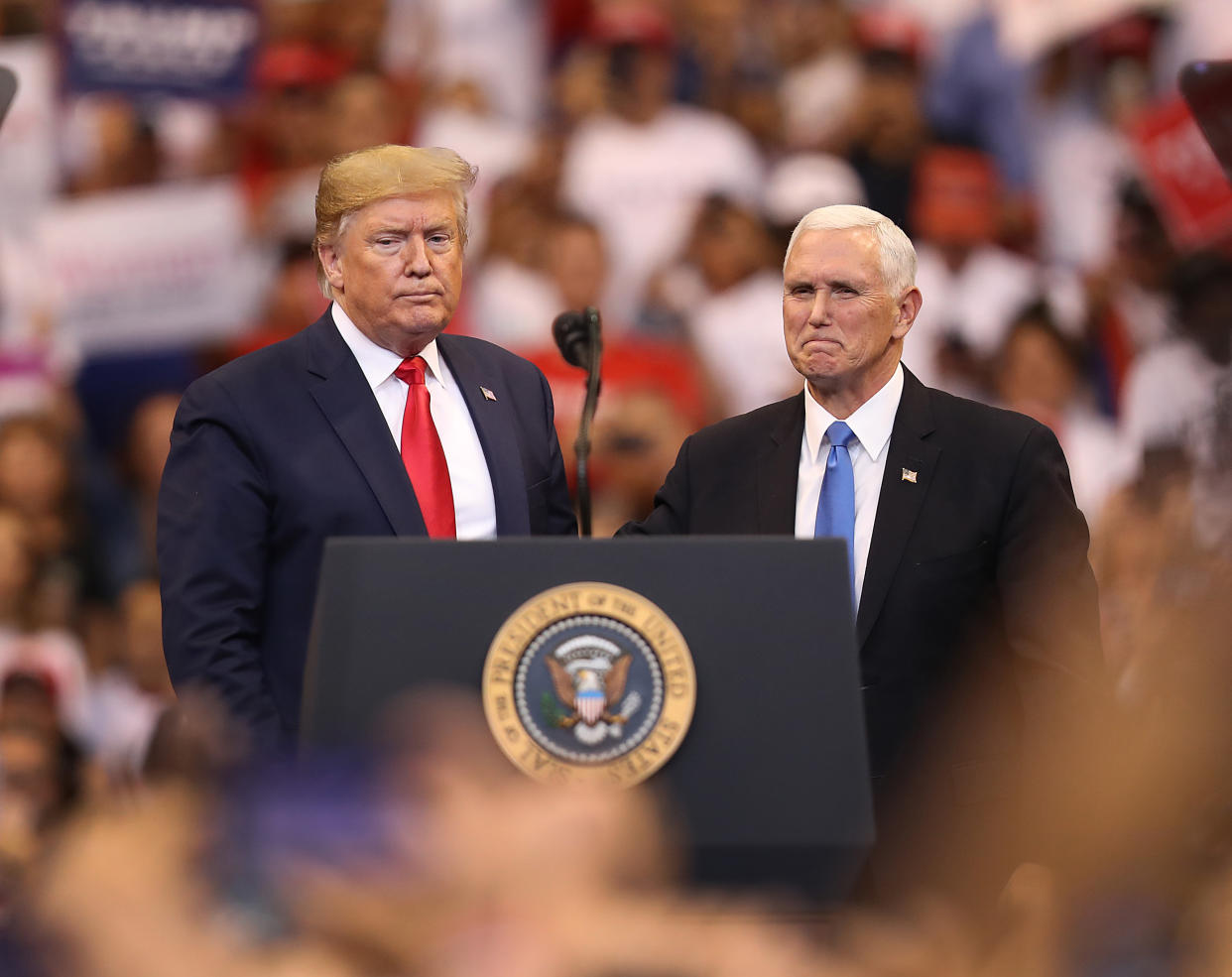 Then-President Donald Trump and Pence stand together during a campaign rally on Nov. 26, 2019, in Sunrise, Fla.