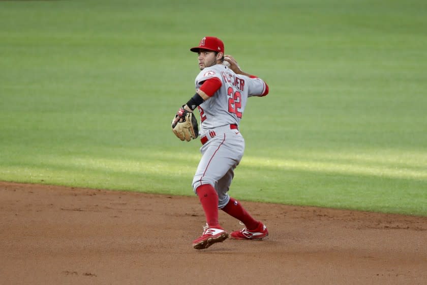 Angels shortstop David Fletcher throws to first during a game against the Texas Rangers on Aug. 8.