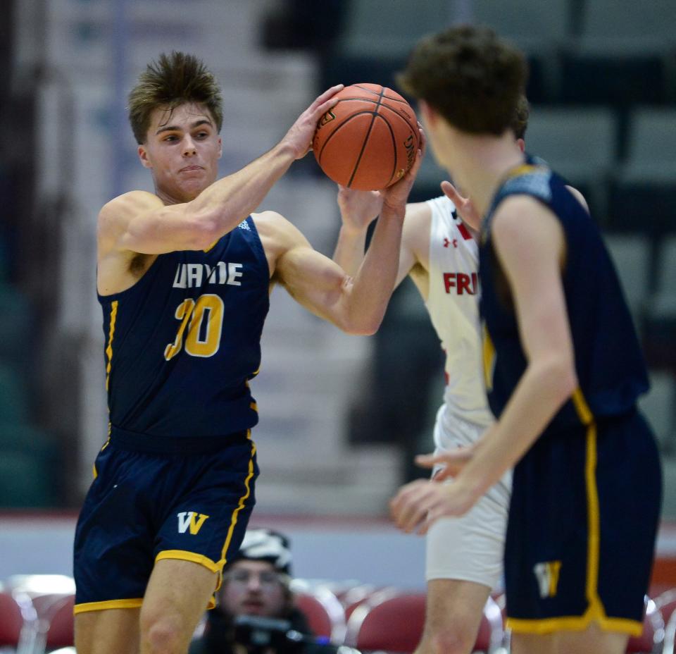 Wayne’s PJ Ostrowski, left, intercepts a pass intended for Friends Academy's Jackson O’Brien during a NYSPHSAA Class A Boys Basketball Championships semifinal in Glens Falls, N.Y., Friday, March 15, 2024. Wayne advanced to the Class A final with a 61-48 win over Friends Academy-VIII.