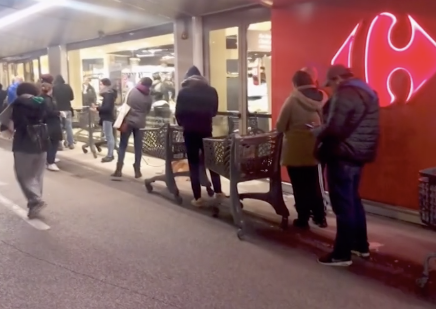 Shoppers with their trolleys outside a supermarket in Italy. Independent business owners are worried what the coronavirus lockdown will do to the economy.