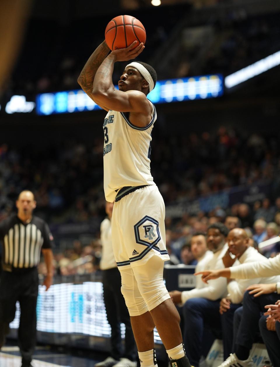 Rhode Island forward David Green takes — and makes — a 3-point shot against UMass on Saturday at the Ryan Center. A total of 5,496 fans showed up to watch, a season-best.