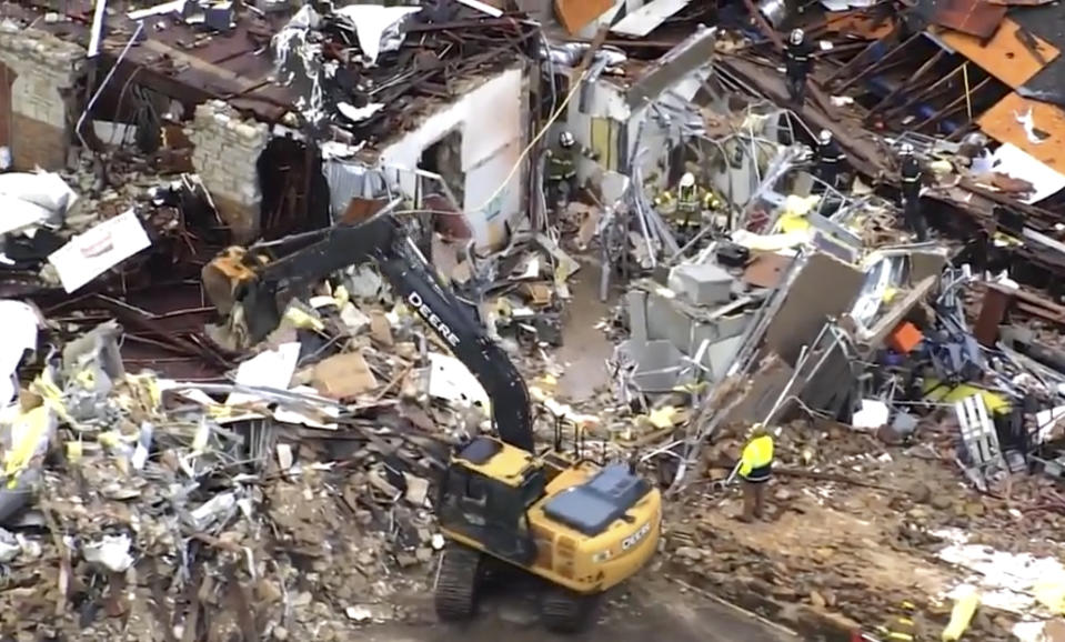 This image taken from video provided by KOCO shows a crew working on clearing debris caused by a tornado in Sulphur, Okla., Sunday, April 28, 2024. (KOCO via AP)