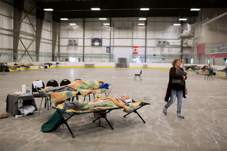 Fort McMurray residents rest a community centre in Anzac, Alberta, after residents were ordered to be evacuated due to a raging wildfire, May 4, 2016. REUTERS/Topher Seguin