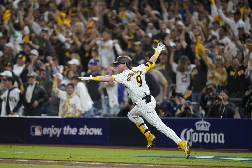 San Diego Padres&#39; Jake Cronenworth reacts after hitting a two-run single during the seventh inning in Game 4 of a baseball NL Division Series against the Los Angeles Dodgers, Saturday, Oct. 15, 2022, in San Diego. (AP Photo/Jae C. Hong)