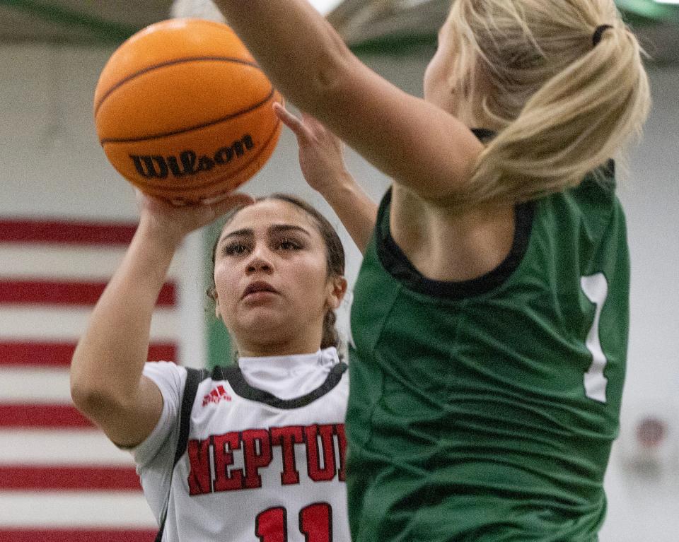 Neptune Christa Ramos drives to the basket against Raritan’s Brooke Shea. Neptune Girls Basketball defeats Raritan in Raritan NJ on January 18, 2024.