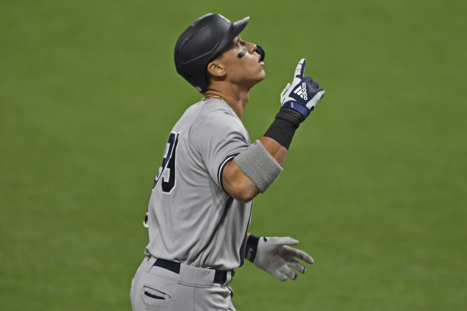 New York Yankees' Aaron Judge (99) runs the bases after hitting a two-run home run off Cleveland Indians starting pitcher Shane Bieber (57) in the first inning of Game 1 of an American League wild-card baseball series, Tuesday, Sept. 29, 2020, in Cleveland. (AP Photo/David Dermer)