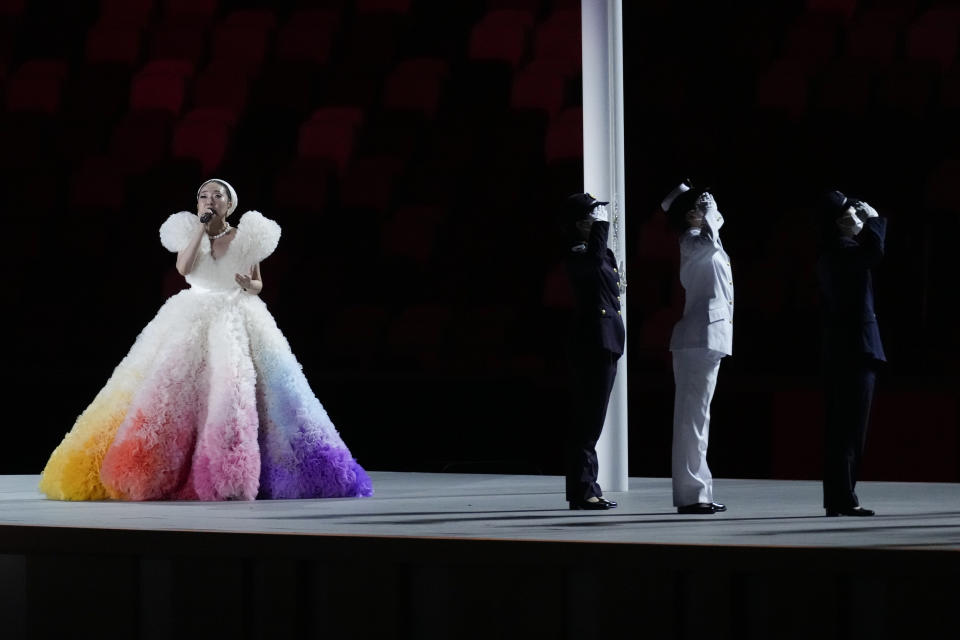 <p>Misia performs during the Japan flag raising during the opening ceremony in the Olympic Stadium. (AP Photo/Ashley Landis)</p> 