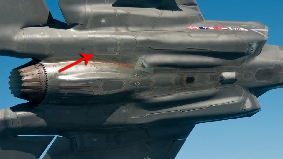 An arrow points to the towed decoy deployment door on the F-35. This is located just aft of the dual flip-open infrared countermeasures dispenser door. <em>Lockheed Martin</em>