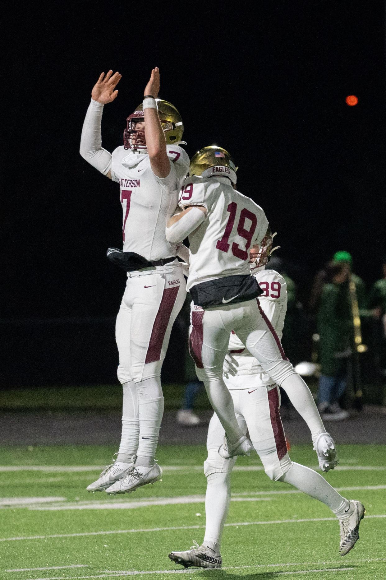 Watterson's A.J. McAninch (7) and Cal Mangini (19) celebrate a 27-14 win over Celina in a Division III state semifinal.