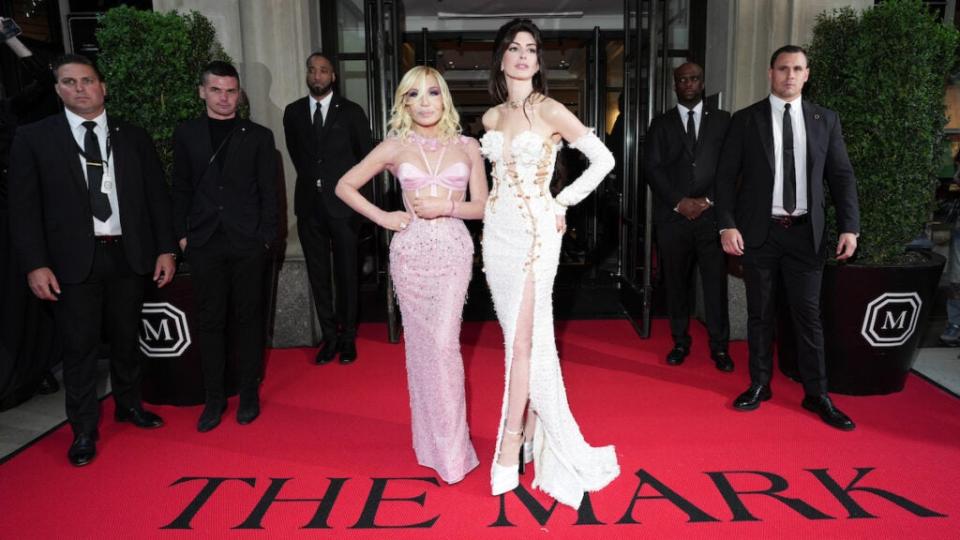 From left, Donatella Versace and Anne Hathaway depart The Mark Hotel for the 2023 Met Gala. (Ilya S. Savenok/Getty Images for The Mark)