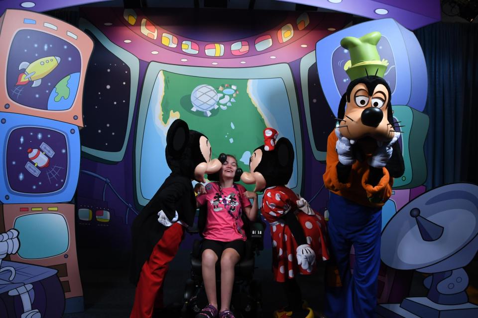 Bethany Hildebrandt says there's no place that accommodates her daughter Kaylee like Disney World. This photo was taken before the pandemic. Character encounters are now socially distanced.