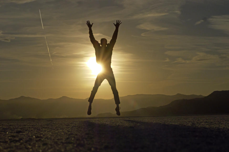 A visitor jumps for a photo at the Bonneville Salt Flats on Saturday, Oct. 8, 2022, near Wendover, Utah. (AP Photo/Rick Bowmer)