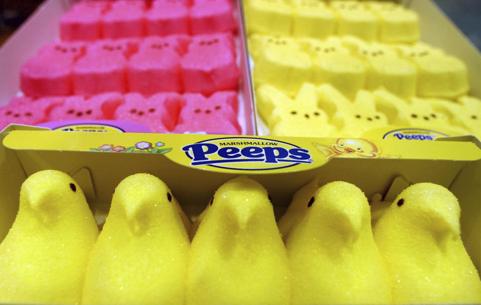 FILE - In this April 2, 2003 file photo, boxes of Marshmallow Peeps are lined up at the Just Born factory in Bethlehem, Pa. The Bethlehem, Pa.,-based Just Born confections company said its production facilities there and in Philadelphia closed Wednesday, March 25, 2020, through April 7. The company says it had already produced and shipped the Easter supply of its signature marshmallow confection to outlets.(AP Photo/Rick Smith, File)