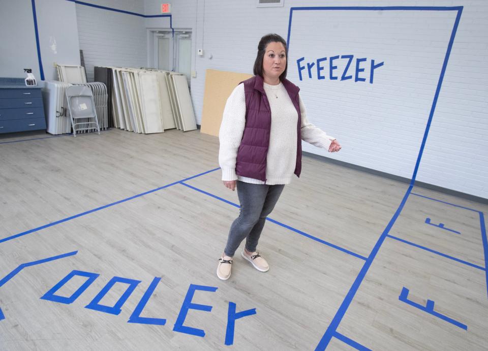 Abby Honaker Schroeder,Director of the Regula Center for Public Service and Engagement stands in an area that will soon be a Stark Fresh Grocery Store at Alliance Commons.