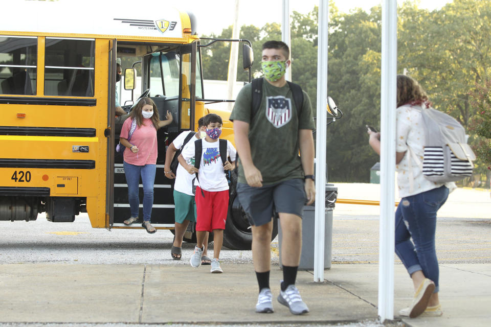 Students wearing masks head to class at Mooreville High School in Mooreville, Mississippi, on Thursday. The high school is not part of the Corinth School District, where seven coronavirus cases were confirmed.  (Photo: ASSOCIATED PRESS)