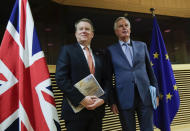 FILE - In this Monday, March 2, 2020 file photo, European Union chief Brexit negotiator Michel Barnier, right, speaks with the British Prime Minister's Europe adviser David Frost during Brexit trade talks between the EU and the UK, at EU headquarters in Brussels. EU and U.K. negotiators have yet to find a way to overcome "significant divergences" in their attempt to seal a post-Brexit compromise, a spokesman for the European Union's executive arm said on Thursday, July 9, 2020. (Olivier Hoslet. Pool Photo via AP, File)