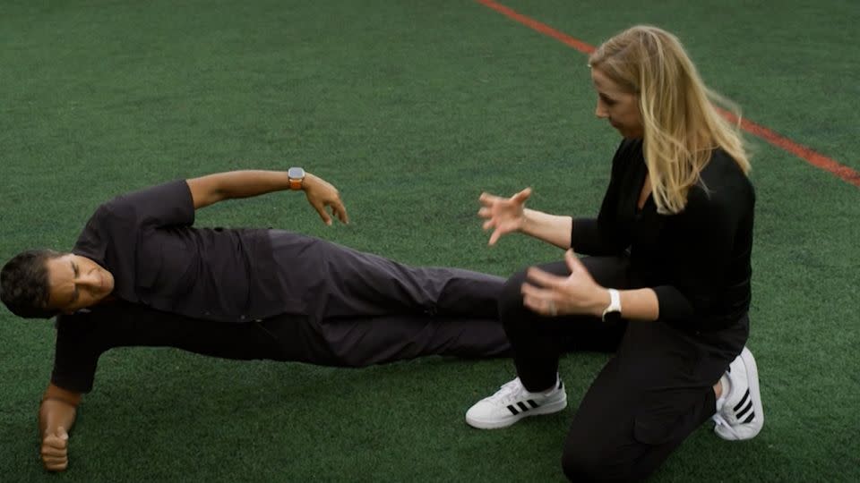 Holly Silvers-Granelli shows CNN Chief Medical Correspondent Dr. Sanjay Gupta one of the exercises in her injury prevention program. - CNN