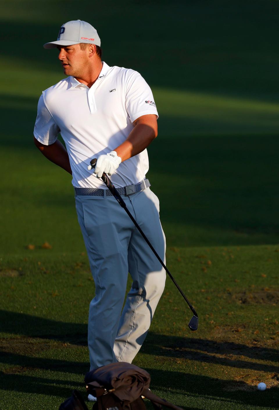 Bryson DeChambeau warms up on the practice range.