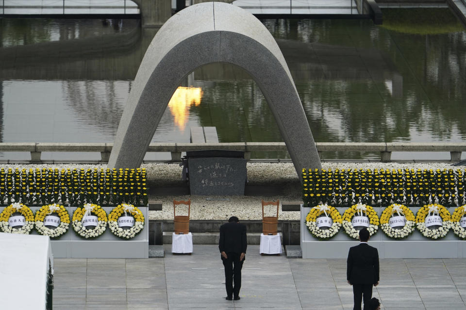 Japanese Prime Minister Shinzo Abe bows in front of Hiroshima Memorial Cenotaph during a ceremony to mark the 75th anniversary of the bombing at the Hiroshima Peace Memorial Park Thursday, Aug. 6, 2020, in Hiroshima, western Japan. (AP Photo/Eugene Hoshiko)