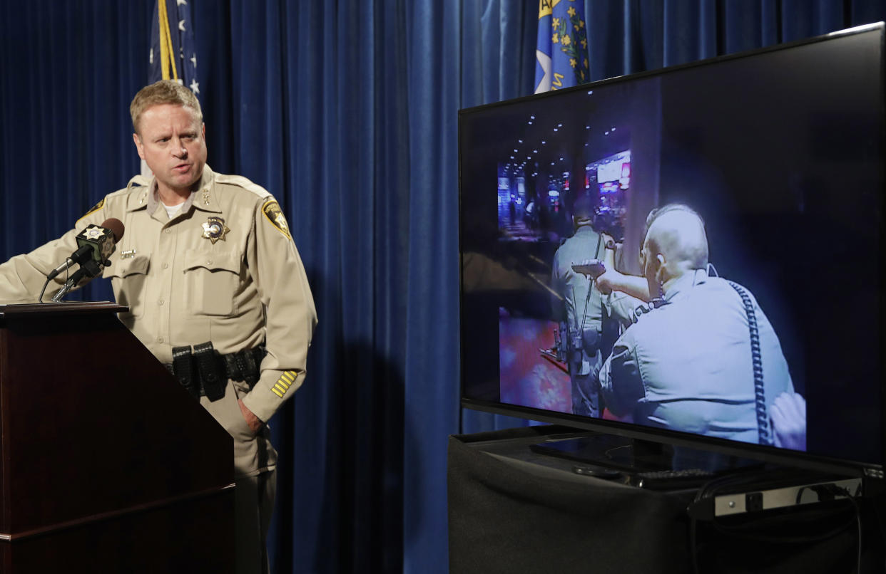 Las Vegas police Undersheriff Kevin McMahill watches body camera footage during a news conference Wednesday. (AP) 