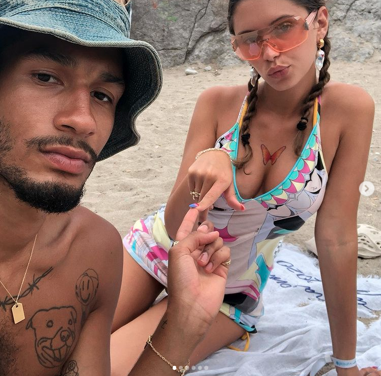 Iris Law and boyfriend Jyrell pose on the beach.