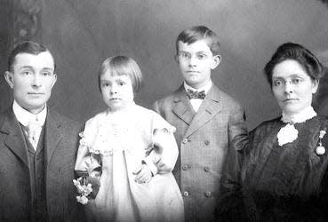Here, the Schnebly family sits for a portrait in 1905 upon returning to their home town of Gorin, MO after the death of their daughter Pearl. Left to right: T.C. (Carl) Schnebly, daughter Genevieve, son Ellsworth (Tad) and Sedona.