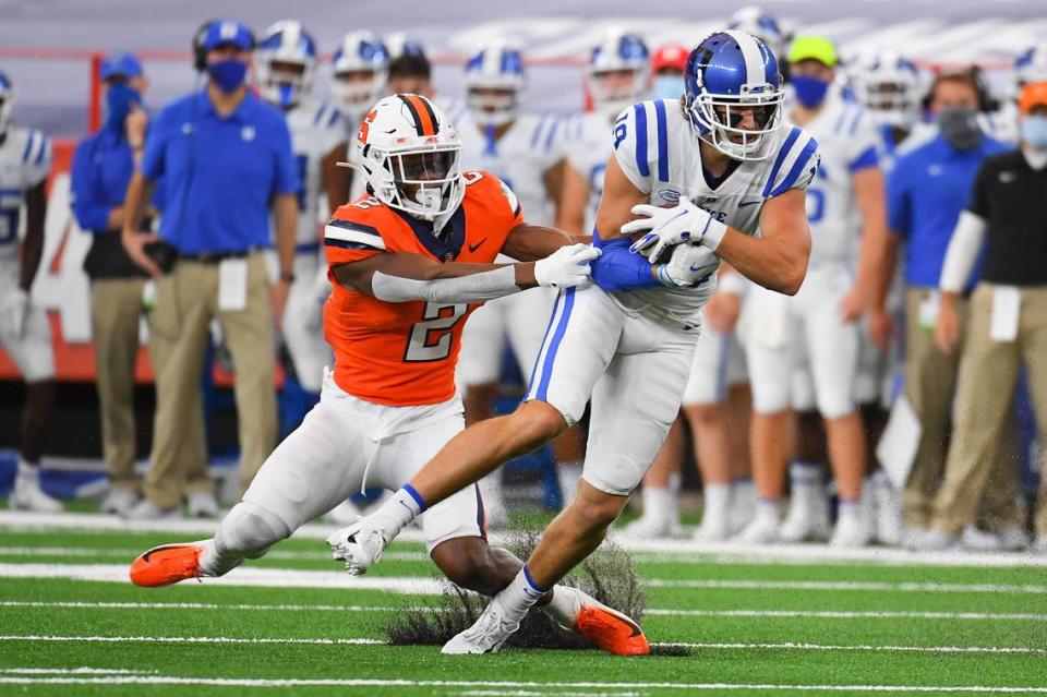 Duke Blue Devils wide receiver Jake Bobo (19) runs with the ball after a catch as Syracuse Orange defensive back Ifeatu Melifonwu (2) defends during the first quarter at the Carrier Dome.