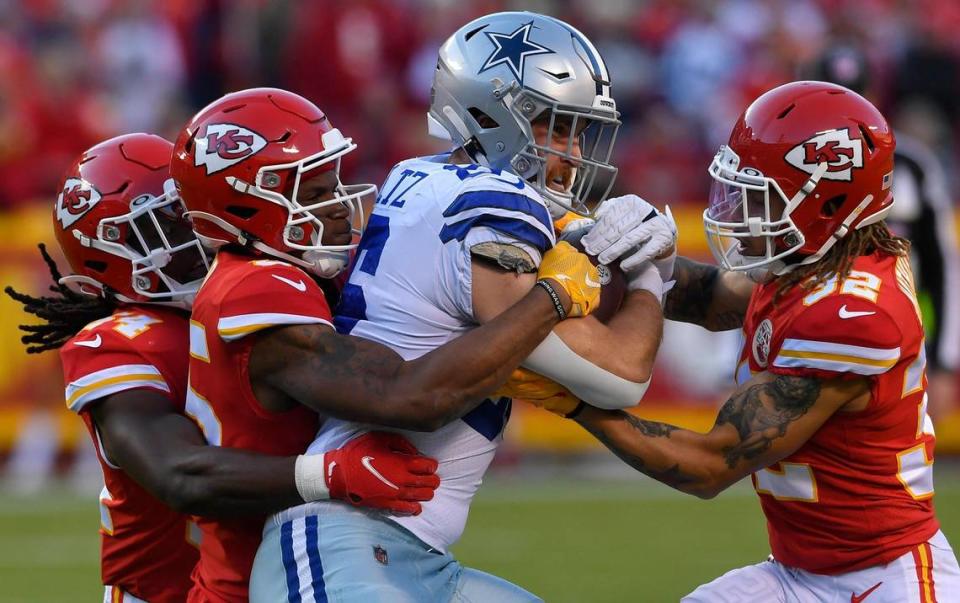 Kansas City defenders Nick Bolton, left, Charvarius Ward and Tyrann Mathieu wrap up Dallas tight end Dalton Schultz during the first quarter of Sunday’s NFL game at Arrowhead Stadium. Kansas City beat Dallas, 19-9.