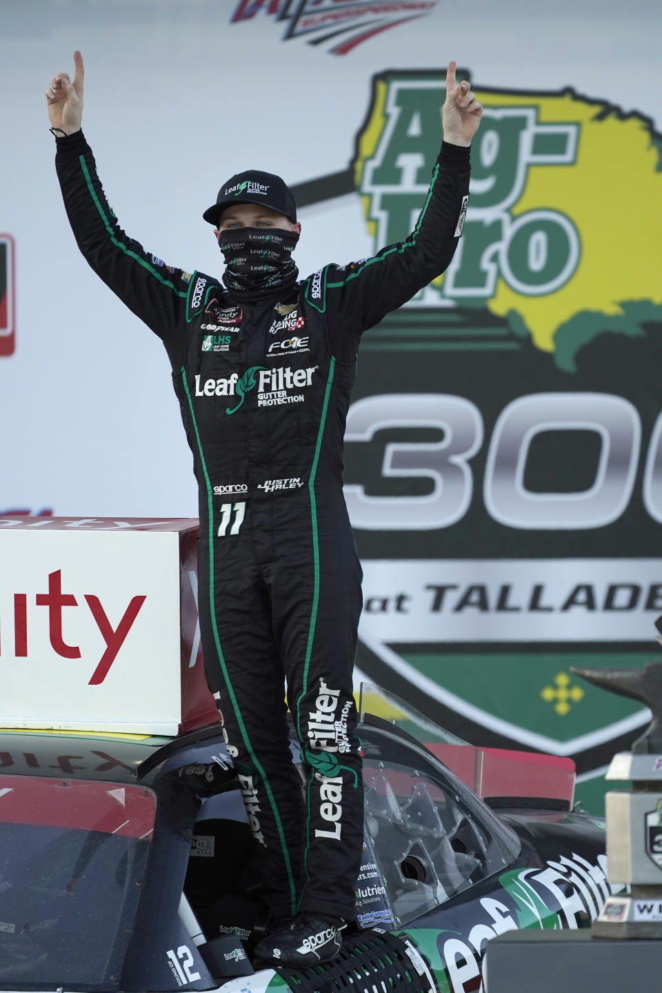 Justin Haley celebrates in Victory Lane after winning a NASCAR Xfinity Series auto race at Talladega Superspeedway, Saturday, Oct. 3, 2020, in Talladega, Ala. (AP Photo/John Bazemore)