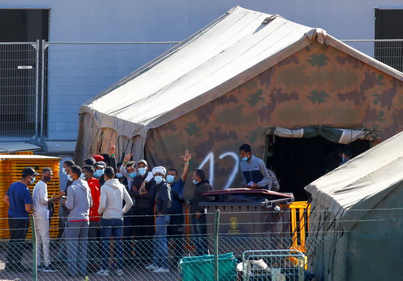 Migrants are seen in a military camp, where they are staying after being rescued by coast guards or reached the island by their own means, in Las Palmas